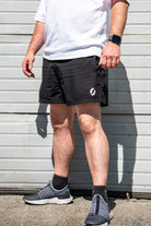 Person wearing Shorts angled, with hands out